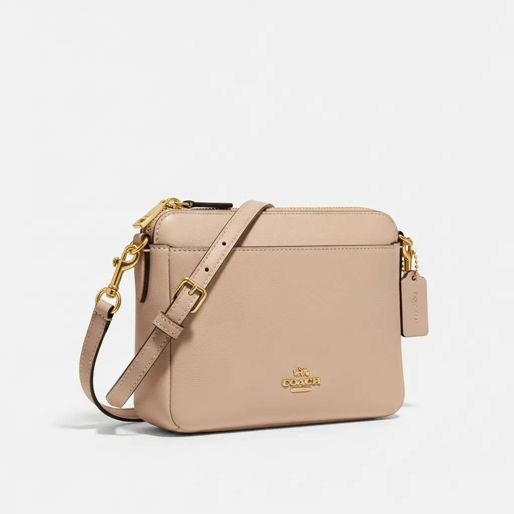 Small beige Coach crossbody bag product shot